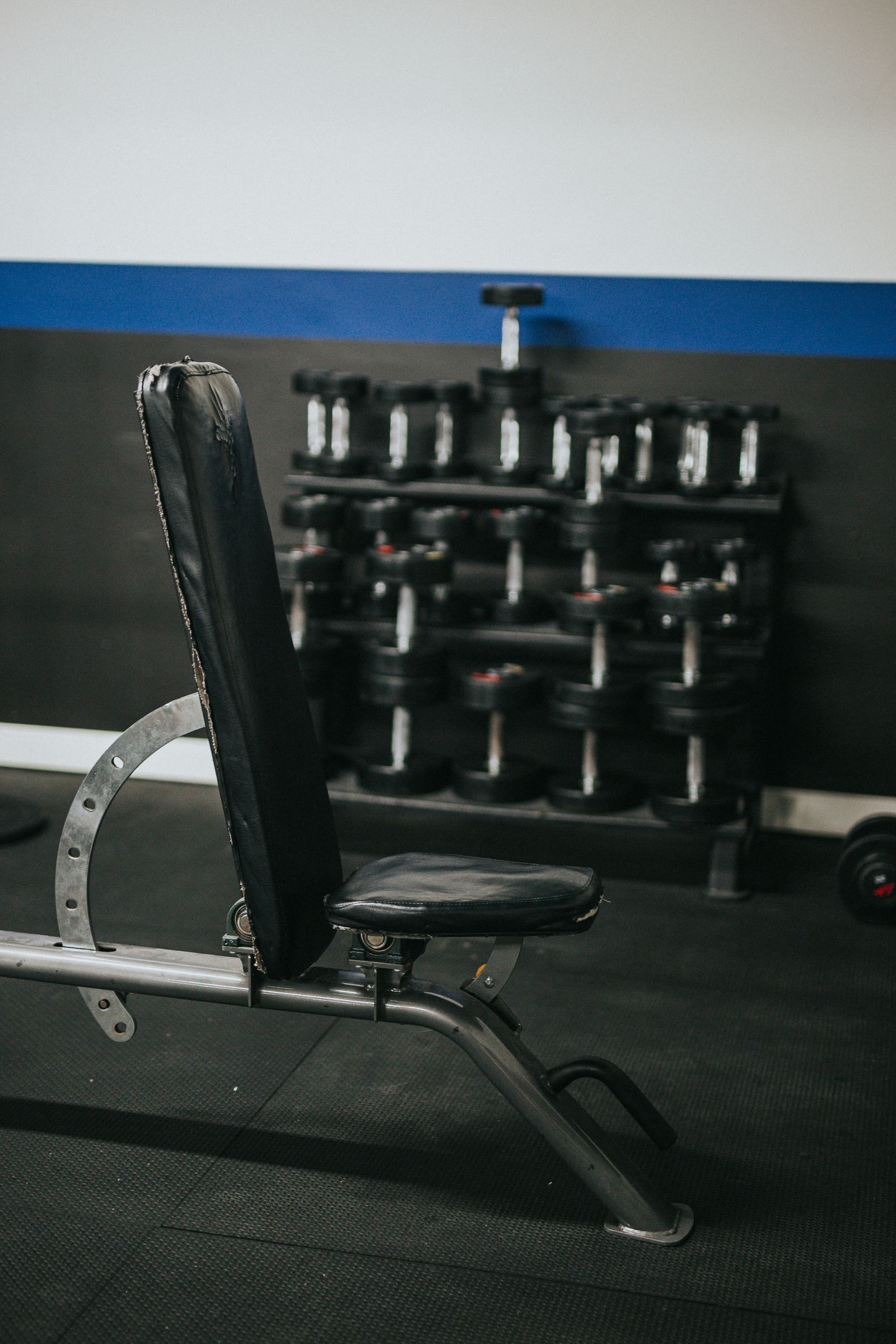 Empty gym bench in dramatic lighting
